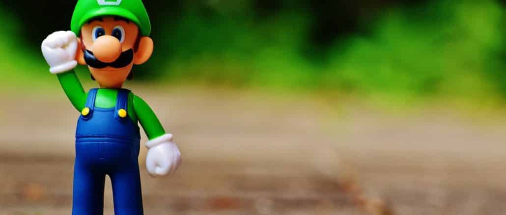 Muñeco de Luigi con el puño arriba simbolizando el triunfo de los juegos blockchain a futuro